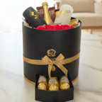 מארז יוקרה עגול עם שמפניה, כוסות ממותגות ושוקולדים